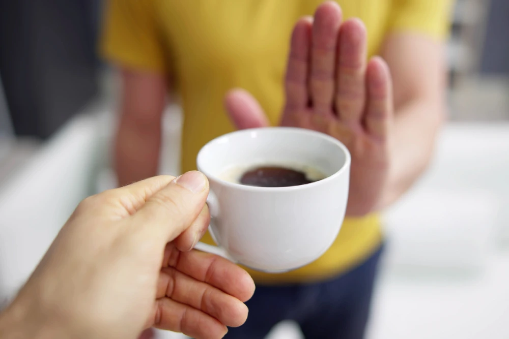 man refusing coffee