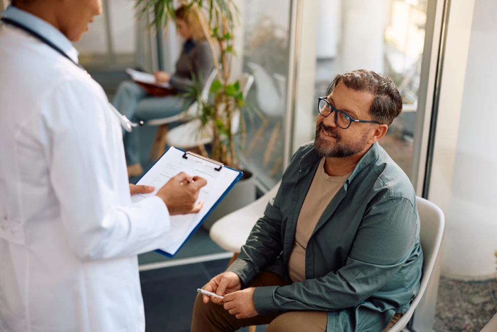 doctor talking to a patient about starting Ozempic for weight loss