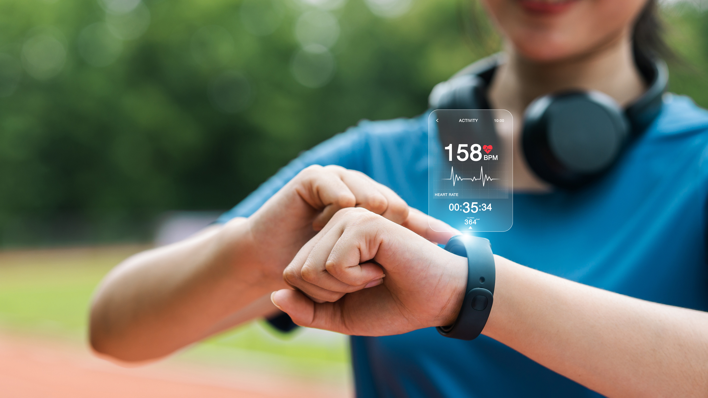 A woman checks uses her smartwatch.
