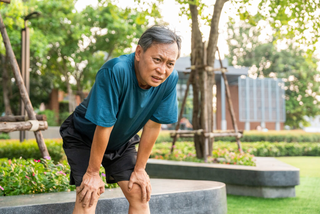 An older man appears dehydrated outdoors.
